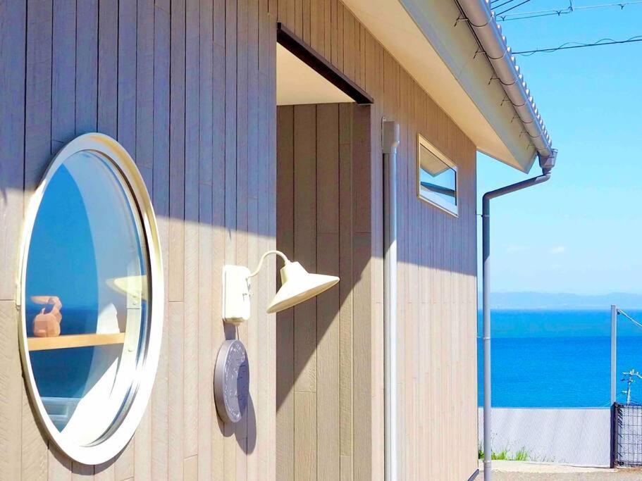 Ferienhaus 「淡路島一棟貸宿　野うさぎ 」高台から海を望む貸別荘！2023年新築離れの素泊まり Awaji